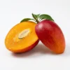 Miyazaki mango sliced in half showing deep orange fiberless flesh and ruby-red skin